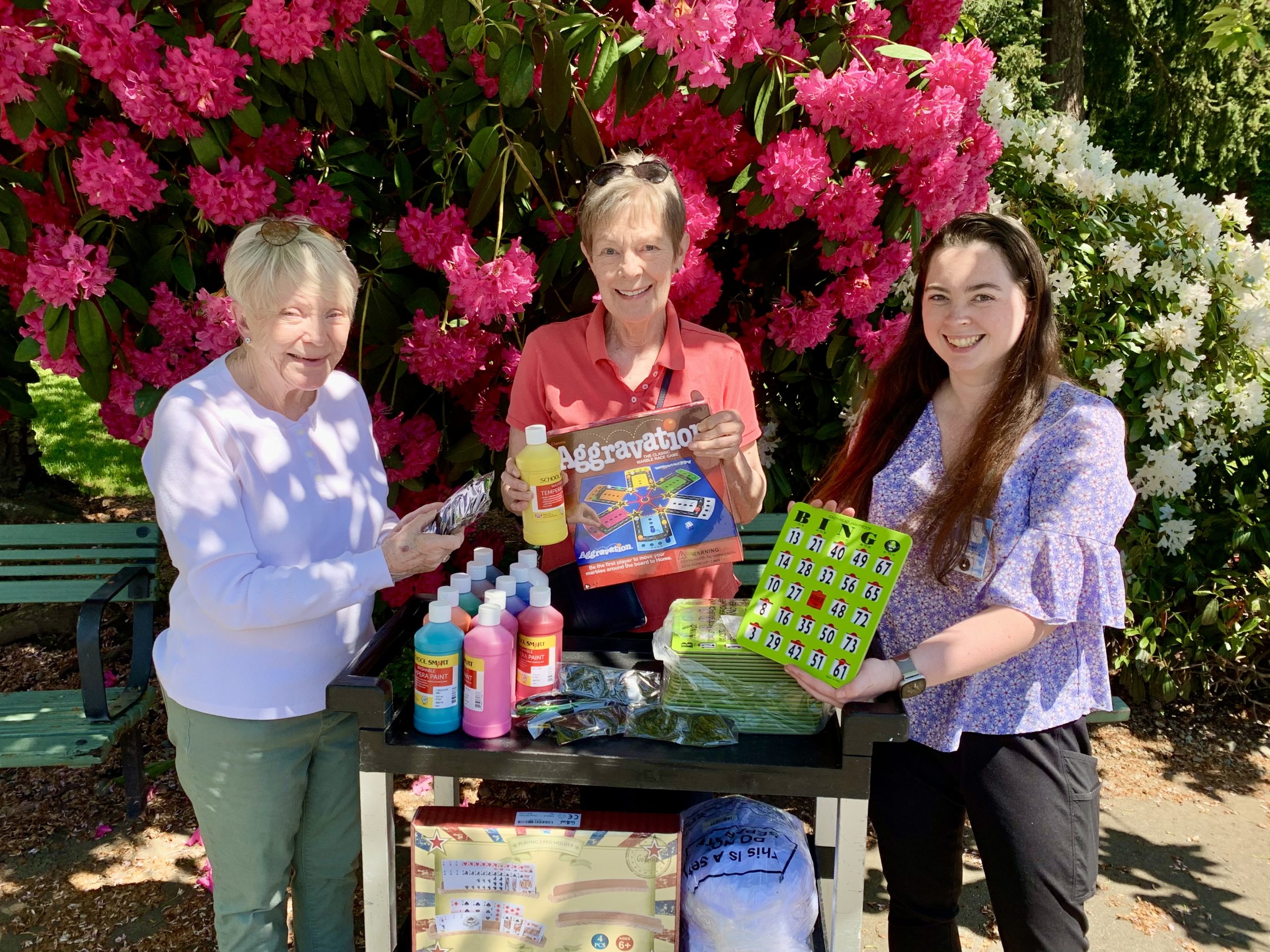 St. Francis Activity Director receives "Spring" gifts from member of the Care Center Support committee.