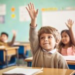 photo of Boy holding hand up in class