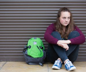 Homeless teen with backpack