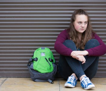 Homeless teen with backpack