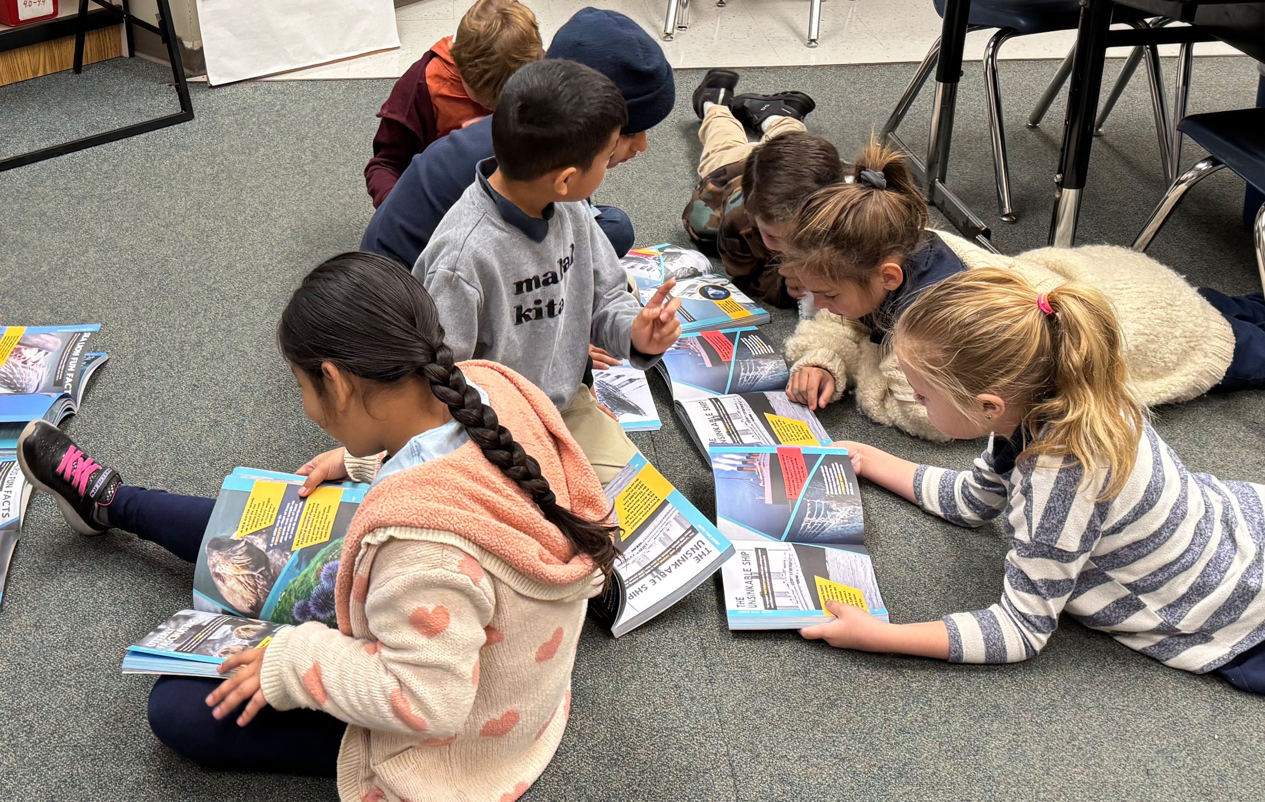 Students with 2025 Holiday Book "Fascinating Ocean Book for Kids"